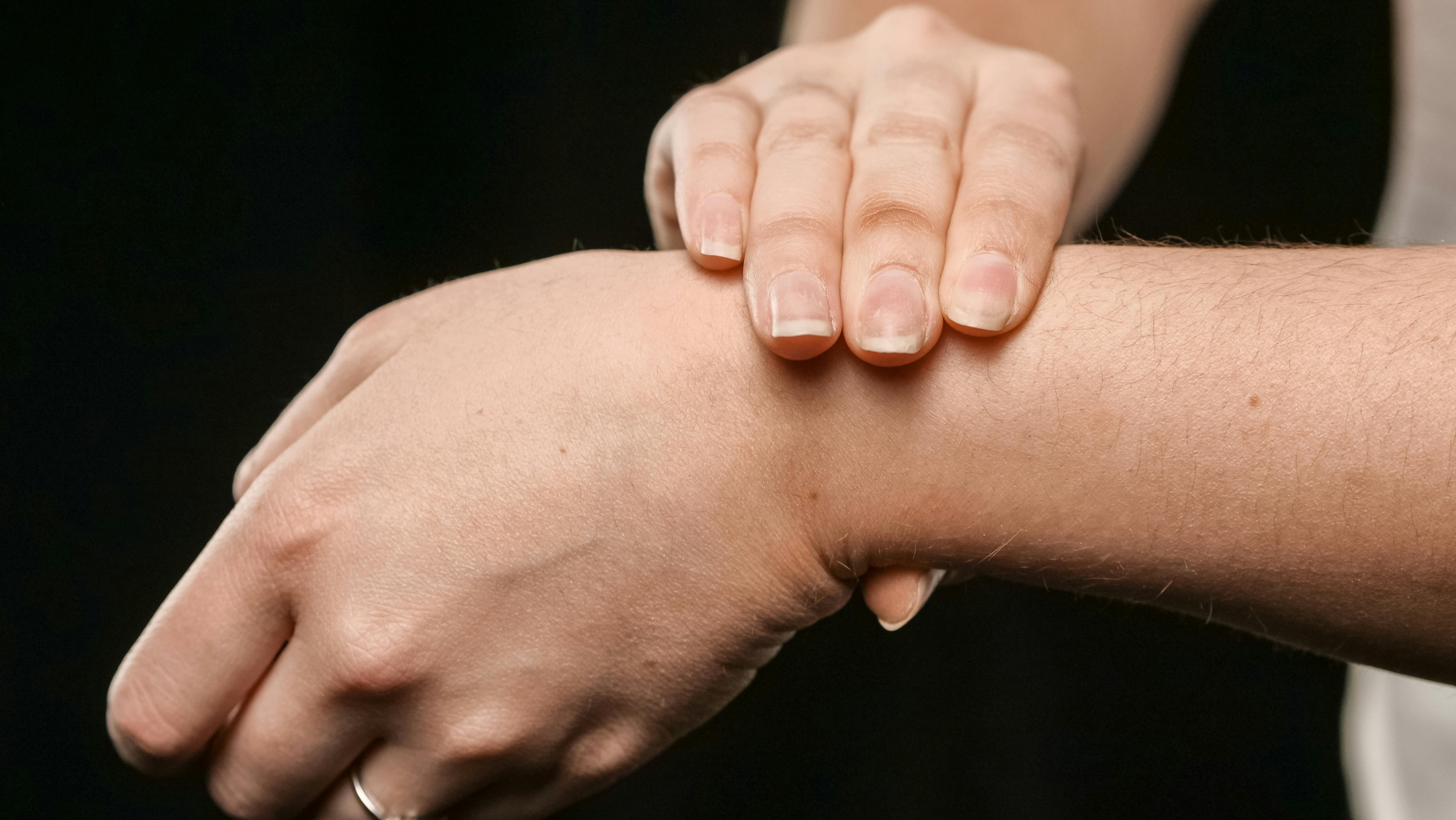 Close-up photo of acupressure on the inner wrist.